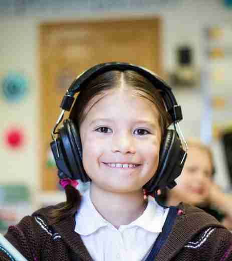 Smiling child with headphones on